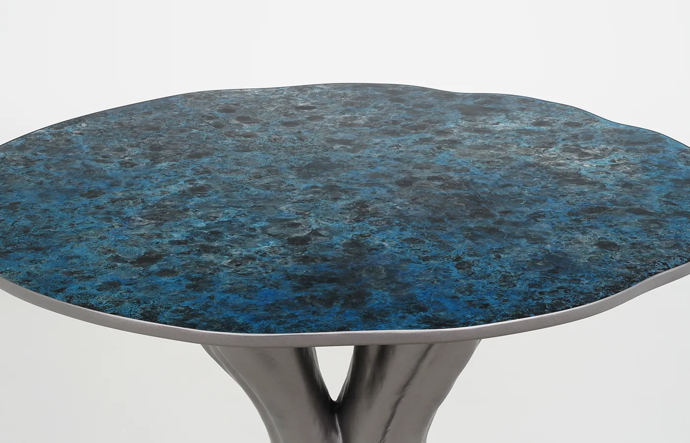 Close-up of artistic tabletop in shades of blue for Athos dining table