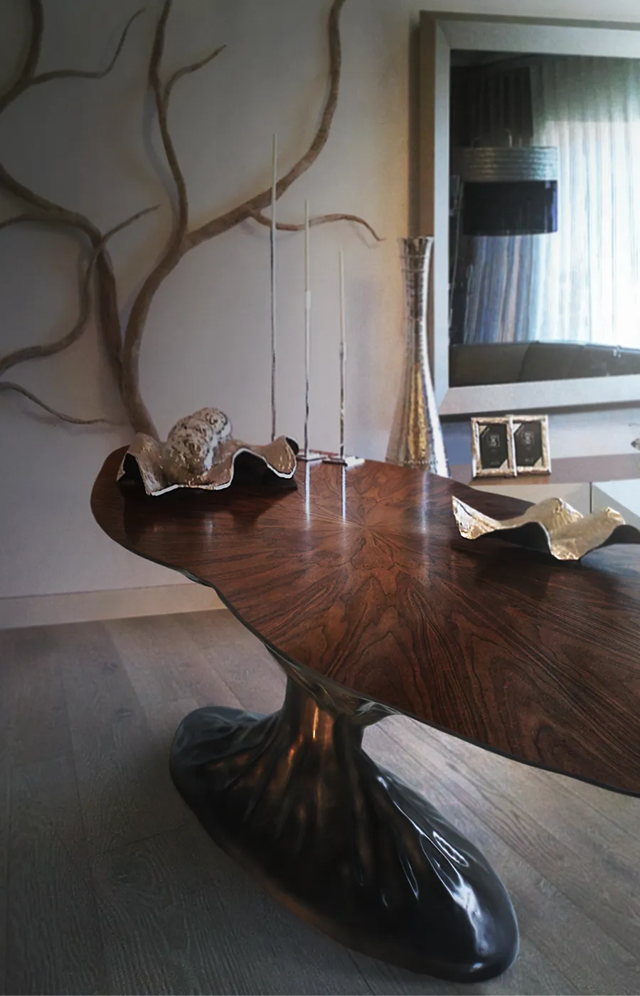 Dining area with Bonsai dining table in brass color and burr walnut top