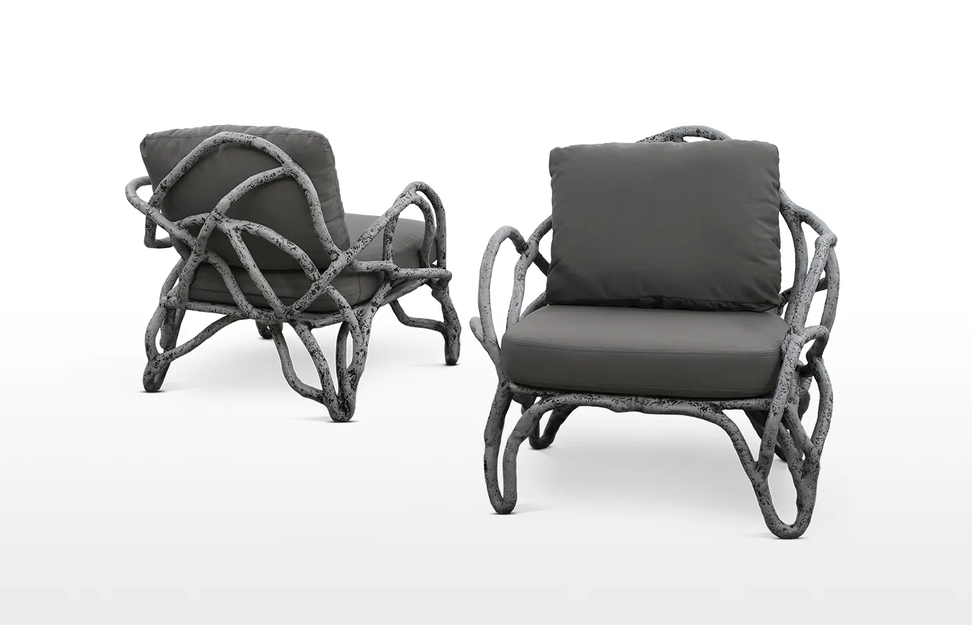 Eros armchair with body in aged concrete color finish and grey fabric upholstery