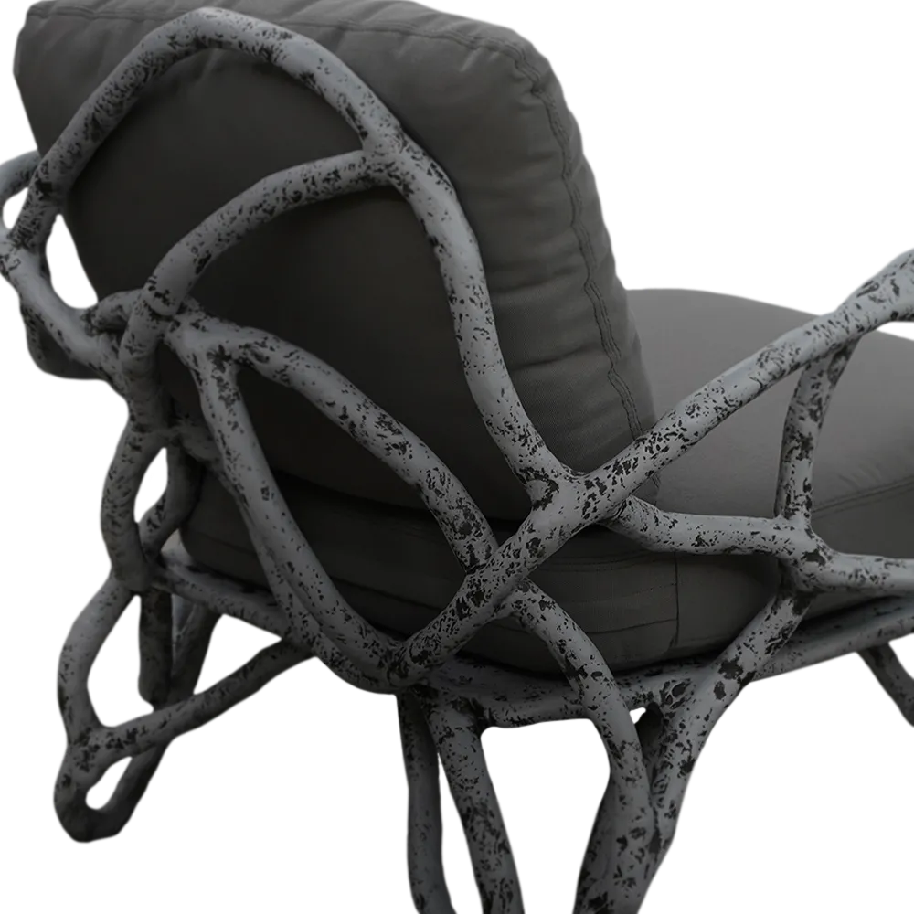 Detailed view of the Eros armchair, highlighting its root-inspired structure