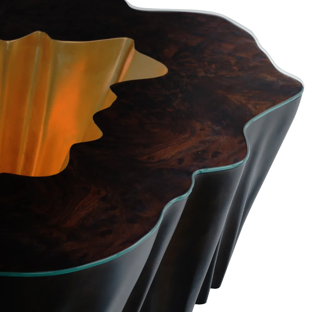 Detailed view of the top of the Gaia coffee table in walnut root and gold