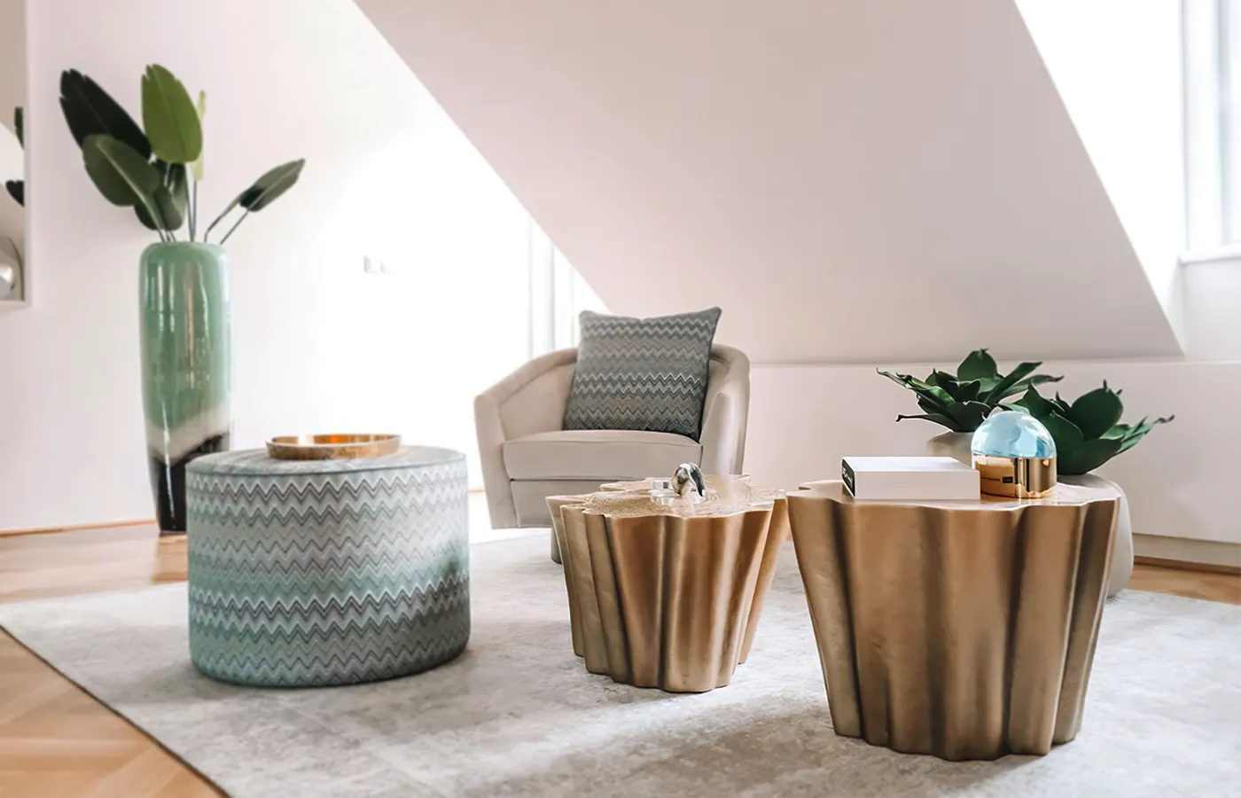 Waiting area with two Gaia side tables in textured gold