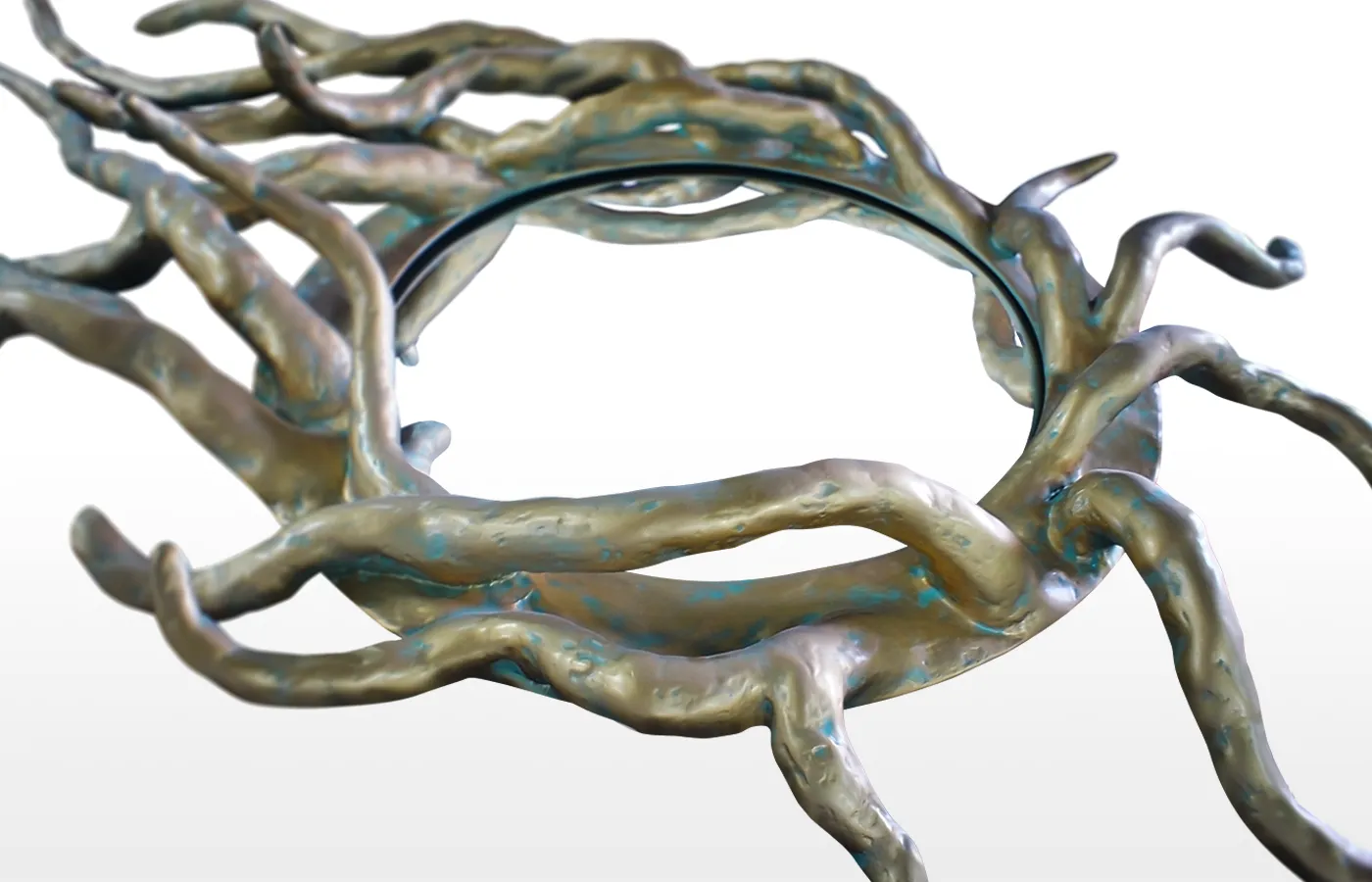 Close-up view of the Helios mirror in antique gold finish