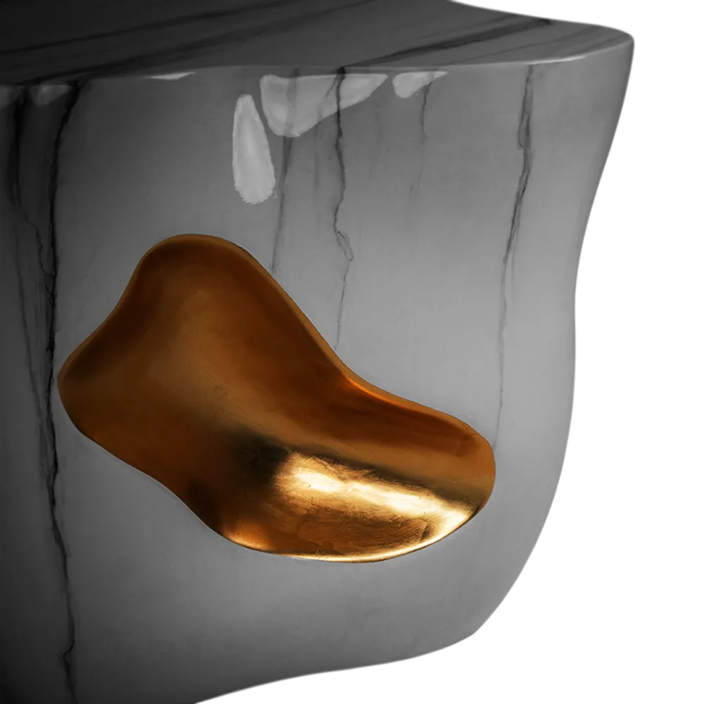 Detailed view of the Oasis side table, highlighting its shape and gold leaf and marbled finish