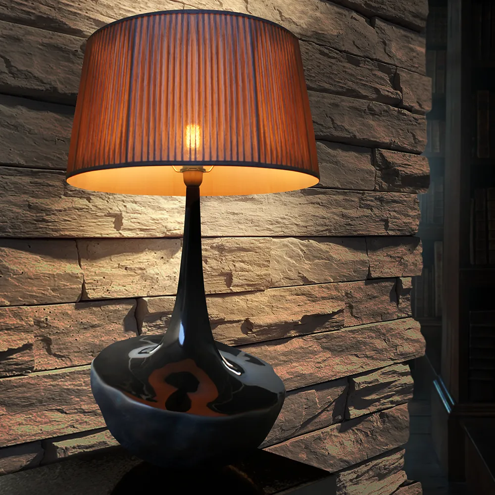 Vista aproximada de candeeiro de mesa Ónix com luz ligada em ambiente escuro