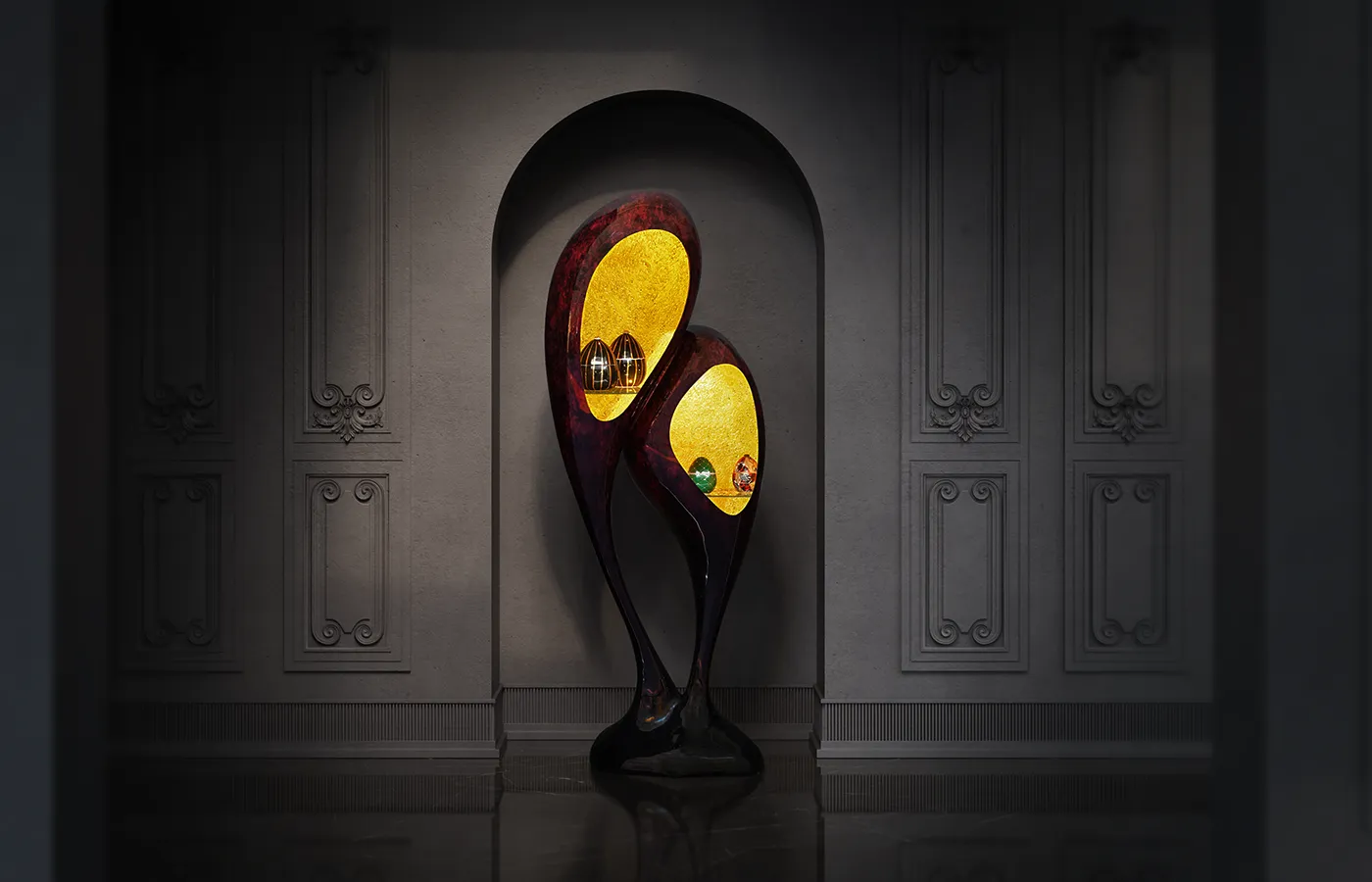 Classic marble hall with Origin bar display cabinet in the center with red opal finish and textured gold leaf interior with LED lighting