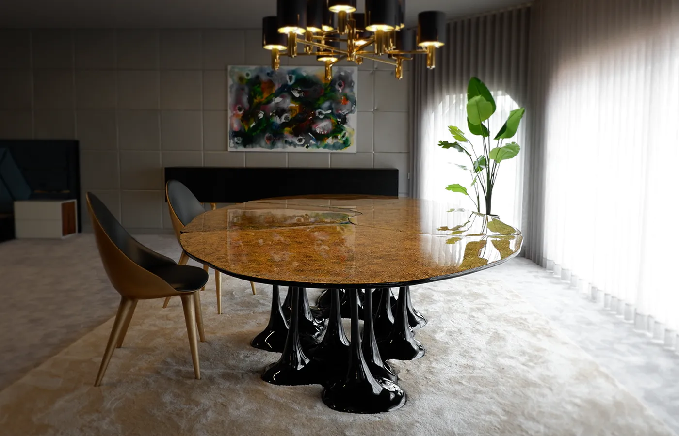 Pangea dining table in a modern dining room with textured gold leaf finish