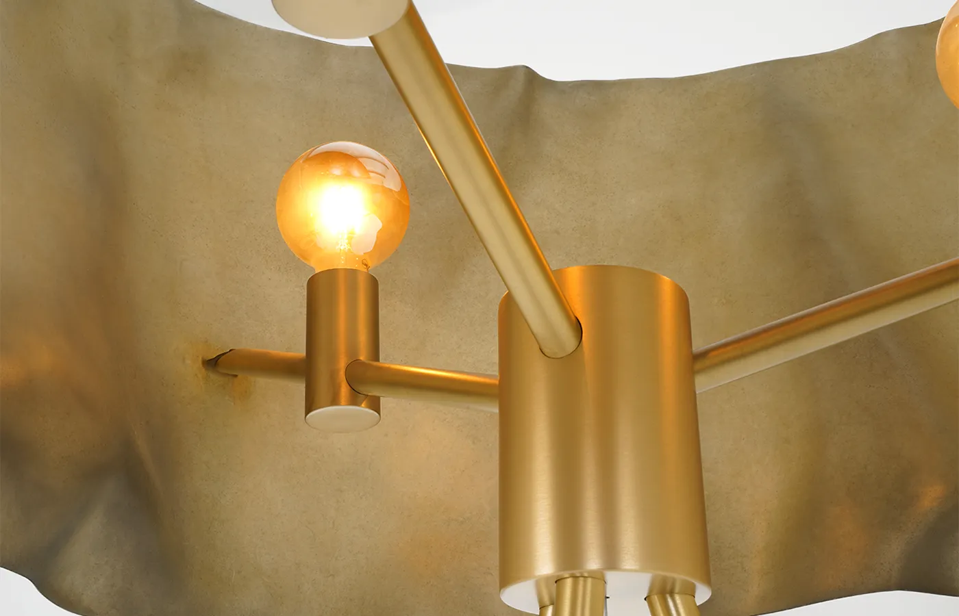 Close up of Ruby floor lamp showcasing the brushed brass structure and the vintage LED lamp