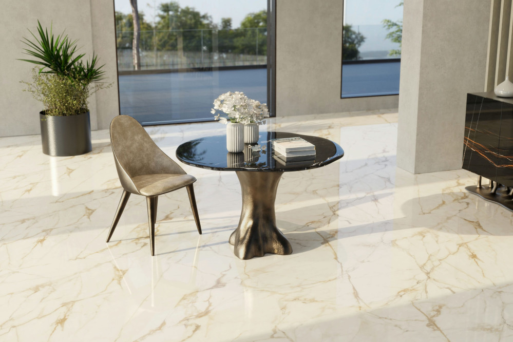 Calypso dining table with bronze finish and black silk marble top